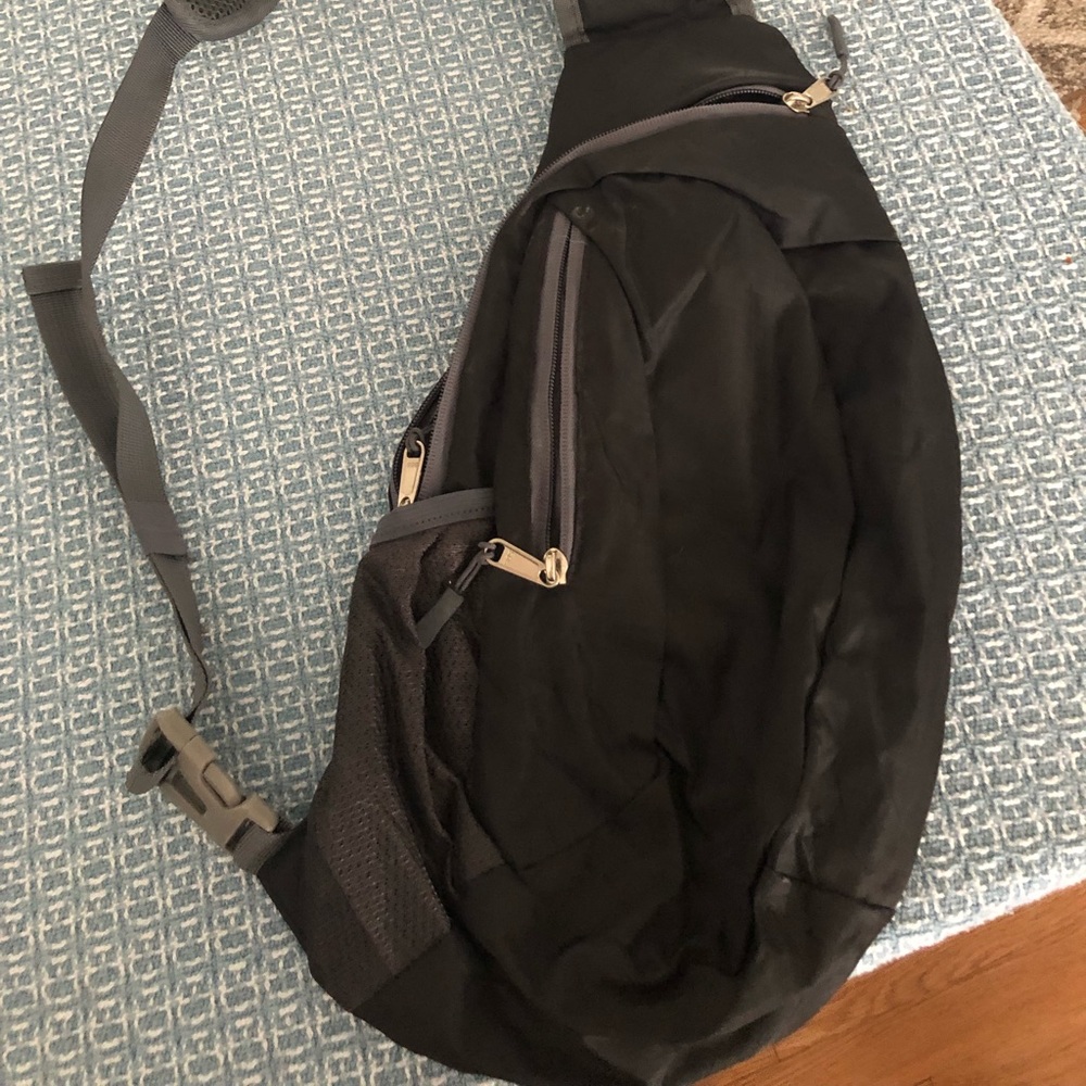 Nylon, athletic sling bag. Black.